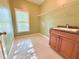 Functional laundry room with built-in cabinets, sink, wire shelving, and a window allowing for natural light at 2080 Village Station Xing, Smyrna, GA 30080