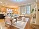 Inviting living room featuring hardwood floors, fireplace, and comfortable seating; open to the kitchen at 2080 Village Station Xing, Smyrna, GA 30080