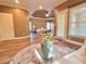 Beautiful living room offering tray ceilings, wood floors, and views into the spacious primary bedroom at 2080 Village Station Xing, Smyrna, GA 30080