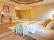 Spacious primary bedroom featuring a sitting area, wood floors, tray ceilings, and soft, neutral colors at 2080 Village Station Xing, Smyrna, GA 30080