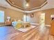 Luxurious primary bedroom with tray ceilings, wood floors, an ensuite bathroom, and ample space at 2080 Village Station Xing, Smyrna, GA 30080