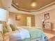This primary bedroom suite offers wood flooring, a tray ceiling, and an ensuite bath for convenience at 2080 Village Station Xing, Smyrna, GA 30080