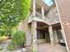 This patio has stone supports and a upper deck with a ceiling fan at 2080 Village Station Xing, Smyrna, GA 30080