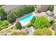 Aerial view of community pool with lounge chairs and lush landscaping at 2080 Village Station Xing, Smyrna, GA 30080