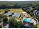 Aerial view of community amenities including tennis courts, soccer field, pool and playground at 4055 Vista Point Ln, Suwanee, GA 30024