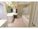 Large primary bathroom featuring double vanity, glass shower and large tub at 4055 Vista Point Ln, Suwanee, GA 30024