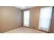 Neutral bedroom featuring carpet, neutral walls, and bright natural light from windows at 4055 Vista Point Ln, Suwanee, GA 30024