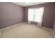 Clean bedroom featuring carpet and a window bringing in natural light at 4055 Vista Point Ln, Suwanee, GA 30024