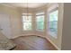 Cozy breakfast nook with natural light, view to backyard deck, and hardwood floors at 4055 Vista Point Ln, Suwanee, GA 30024