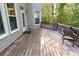 Back deck featuring a chair with wooded scenery at 4055 Vista Point Ln, Suwanee, GA 30024
