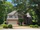 Charming two-story brick home with mature trees and a well-manicured lawn at 4055 Vista Point Ln, Suwanee, GA 30024