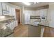 Spacious kitchen with granite countertops, white cabinets, and stainless steel appliances at 4055 Vista Point Ln, Suwanee, GA 30024