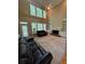 Bright living room featuring a fireplace, high ceilings, and built-in shelving at 4055 Vista Point Ln, Suwanee, GA 30024