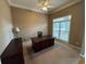 Cozy home office featuring a ceiling fan, carpet and natural light from a window at 4055 Vista Point Ln, Suwanee, GA 30024