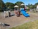 Community playground with climbing wall, slides, and other play structures at 4055 Vista Point Ln, Suwanee, GA 30024