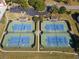 Aerial view of four well-maintained tennis courts with parking and walking paths at 4055 Vista Point Ln, Suwanee, GA 30024