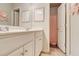 Bathroom featuring a double vanity with white cabinets and a view into the separate shower room at 5601 Savannah River Rd, Atlanta, GA 30349
