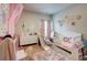 Bright, charming bedroom with kid-friendly décor, including a bed with built-in slide at 5601 Savannah River Rd, Atlanta, GA 30349