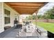 Well-appointed outdoor living space with comfortable seating and a dining area at 5601 Savannah River Rd, Atlanta, GA 30349