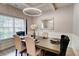 Elegant dining room with a modern chandelier, stylish wallpaper and an elegant wooden table at 5601 Savannah River Rd, Atlanta, GA 30349