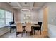 Elegant dining room with a modern chandelier, stylish wallpaper and an elegant wooden table at 5601 Savannah River Rd, Atlanta, GA 30349