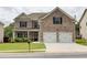 Beautiful two-story brick home featuring a two-car garage and a well-maintained front yard at 5601 Savannah River Rd, Atlanta, GA 30349