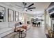 Open concept living room with modern decor, large ceiling fan, and a seamless flow to the kitchen at 5601 Savannah River Rd, Atlanta, GA 30349