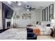 Open concept living room featuring modern light fixtures and furniture at 5601 Savannah River Rd, Atlanta, GA 30349