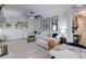 Cozy living room with large sectional sofa, modern ceiling fan, and stylish round nesting tables at 5601 Savannah River Rd, Atlanta, GA 30349
