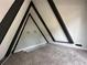 Unique A-frame attic design with new carpeting and modern lighting at 6774 Collier Rd, Riverdale, GA 30296