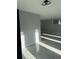 Open basement space featuring gray walls and large marble looking tile at 6774 Collier Rd, Riverdale, GA 30296