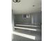 Brightly lit basement with light gray walls, marble looking tile, and recessed lighting at 6774 Collier Rd, Riverdale, GA 30296