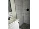 This bathroom features a neutral paint scheme and a tiled, walk-in shower at 6774 Collier Rd, Riverdale, GA 30296