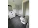 Updated bathroom features a modern vanity, neutral paint, and a walk-in shower at 6774 Collier Rd, Riverdale, GA 30296