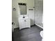 Updated bathroom features a modern vanity, neutral paint, and a walk-in shower at 6774 Collier Rd, Riverdale, GA 30296