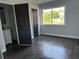Bedroom featuring hardwood floors, an ensuite bathroom, and natural light at 6774 Collier Rd, Riverdale, GA 30296