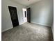 Clean and freshly painted bedroom featuring neutral carpet and modern design at 6774 Collier Rd, Riverdale, GA 30296