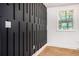 Close-up of a modern accent wall with vertical wood trim and a bright window at 904 Fairburn Nw Pl, Atlanta, GA 30331