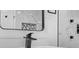 Close-up of a bathroom vanity with black faucet, white countertop, and marble tile in shower at 904 Fairburn Nw Pl, Atlanta, GA 30331