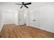 Spacious bedroom with hardwood floors, ceiling fan, and closet at 904 Fairburn Nw Pl, Atlanta, GA 30331