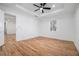 Bright bedroom features hardwood floors, neutral walls, recessed lighting, and a modern ceiling fan at 904 Fairburn Nw Pl, Atlanta, GA 30331