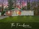 Inviting single-story home featuring a lush green lawn and eye-catching orange door at 904 Fairburn Nw Pl, Atlanta, GA 30331