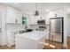 Modern kitchen featuring white cabinets, stainless steel appliances, and quartz countertops at 904 Fairburn Nw Pl, Atlanta, GA 30331