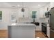 Contemporary kitchen with white cabinetry, stainless appliances, and center island at 904 Fairburn Nw Pl, Atlanta, GA 30331