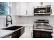Close-up of a kitchen with stainless steel appliances and modern fixtures at 904 Fairburn Nw Pl, Atlanta, GA 30331