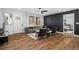 Cozy living room with stylish decor, modern accent wall, and an open doorway to the bedroom at 904 Fairburn Nw Pl, Atlanta, GA 30331