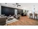 Spacious living room features an accent wall, recessed lighting, a ceiling fan and flows into the dining area at 904 Fairburn Nw Pl, Atlanta, GA 30331
