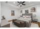 This bright main bedroom features two windows, wood floors, and neutral decor at 904 Fairburn Nw Pl, Atlanta, GA 30331