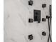 Close up of shower showcasing modern, luxurious black fixtures and marble tile at 904 Fairburn Nw Pl, Atlanta, GA 30331