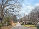 View down a tree-lined street towards other homes at 904 Fairburn Nw Pl, Atlanta, GA 30331